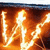Animated icon shows a figure with glowing white lines against an orange background, text 'As the W Burns Bright' appears in blue and yellow.