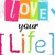 Colorful pixelated text reads 'LOVE your life' with each letter in distinct hues against a white background.