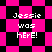 Pixelated text 'Jessie was here!' on a pink and black checkered background with diamond-shaped pattern variations.