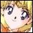 A pixelated anime-style character face with blonde hair and large eyes, next to stylized text on a black background.
