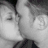 Two people kissing in grayscale, transitioning to color with one person holding a golden crown-like object.