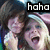 Pixelated image of two people with dark hair and light skin, one with mouth open in laughter, text "haha" above and "<3" below.