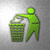 Green pixelated figure discards white object into green trash bin against gray gradient background.