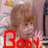 A pixelated static image shows a figure with brown hair and pink clothing, red text at the bottom left, and blurred background elements including yellow and blue shapes.