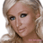 Pixelated image of a person with blonde hair and blue eyes, accompanied by pink text on black background.