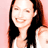Static 48x48 pixel icon of a person with long dark hair wearing a white top against a pink background, rendered in low-resolution pixel art style.