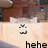 Pixelated image shows a light-colored background with dark text reading 'hehe' and two small black-and-white symbols above it.