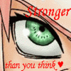 Anime-style close-up of a green eye with black eyeliner, pink hair strands, and red text reading "Stronger than you think" with a heart symbol.