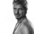 Black-and-white photo of a man with short hair and a necklace, surrounded by pink pixelated text reading 'David Beckham is hot [[so is showe]]'.