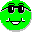 Two side-by-side pixel art frames of a green circular character wearing black sunglasses with white highlights and a wide smile, displayed on a gray background.