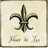 A static image of a fleur-de-lis symbol on a beige background with handwritten text below it.