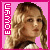 Pixelated image of a person with light brown hair against a pink background, with vertical text on the left side.