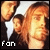 Pixelated static image of three stylized human figures with orange-brown hair against a dark background, featuring white text "FOR" at the bottom left and a bright star-like shape between them.