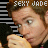 A 4-frame animated contact sheet showing a person with brown hair in various poses, each frame featuring the text "SEXY JADE" overlaid on top and middle sections against a black-and-white striped background.