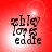 Red background with four identical pixelated text blocks reading 'ashley loves eddie' in black, each block showing slight variations in brightness and blur across frames.