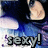 Pixelated image of a person in blue clothing with one arm raised, set against a dark background with light and purple hues, featuring the text 'sexy!' at the bottom.