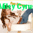 A pixelated image shows a woman with long brown hair lying on a white surface, wearing a white top and blue jeans, with green text above her.