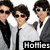 Two figures in suits with sunglasses stand side-by-side; text overlays read 'Hollies With Killer Bodies' across the image.