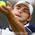 A pixelated image of a tennis player in mid-serve holding a yellow ball, next to bold text reading "I luv Andy" on white background.