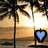 Animated sequence of heart-shaped icons in blue, cyan, green, yellow, orange, and purple against a sunset beach backdrop with palm trees.