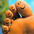 A foot with multiple smiling faces drawn on toes against a blurred outdoor background.