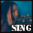 nine identical frames showing a person with long dark hair holding an instrument, each frame displaying the word "SING" in different colors