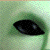 Green-skinned alien character with large black eyes appears in multiple views including close-up, full face, and side profile.