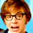 Static pixelated image of a person with brown hair and glasses against a light blue background, rendered in low-resolution style typical of early internet icons.