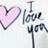 A static pixelated image shows a pink heart symbol and the text "I love you" in dark gray script on a light background.