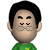 Pixelated character with black hair, glasses, and green shirt showing two facial expressions side-by-side.