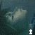 A 4-frame animated contact sheet showing a pixelated face with changing expressions and text overlays across frames, set against a dark teal background.