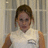 A pixelated image of a person in a white sleeveless top with a pocket, standing against vertical blinds and displaying pink text 'WOW...' on the right.