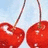 Red cherries with stems against a light blue background, two cherries display 'YUM' text in red pixelated font on black rectangles.