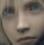 Pixelated close-up of a human face showing eyes, nose, and mouth with blue irises and light skin tones.