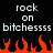Pixelated text reading 'rock on bitchessss' repeated twice above orange flames on black background.