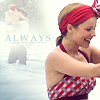 A woman in a red-and-white striped swimsuit and red headband smiles while holding a rope, with a blurred couple kissing in the background and 'ALWAYS' text visible.