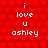 Red background with repeating heart pattern, white text reading "i love u ashley" in two identical vertical