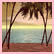 Pixelated beach scene with palm trees, ocean waves, and a sunset sky on brown sand.