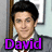 A pixelated image of a person in a gray suit with a white shirt and red tie, featuring purple text labels and a purple heart symbol.