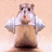 Pixelated hamster-like character in white shirt and brown pants stands against peach background with green text 'Super Mouse!' on right.