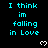 Cyan text "I think im falling in Love" repeated across a black background with white pixelated hearts, gray bottom-right corner.