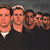 A 50x50 pixel animated contact sheet showing two frames of a group photo with four people on the left and green text reading "Original Icons .com" on the right against a dark background.