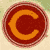 Circular icon with concentric rings in red and orange hues, featuring a stylized C-shaped element in the center against a light background.