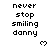 Pixelated text reads 'never stop smiling danny' with a small heart symbol below, displayed in multiple repeated on a white background