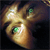 A pixelated golden-brown creature with green eyes and white highlights on a dark background.