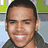 A pixelated image of a person with short dark hair wearing a dark jacket, smiling against a green and gray background with text overlay.