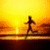 A pixelated image of a person running on a path at sunset with text overlays reading "Live to Run" and "Run to Live."