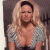 A pixelated image of a woman with long blonde hair wearing a low-cut checkered top, next to green text reading "Original Icons .com" on a dark background.