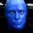 Pixelated blue face icon with bold white text "BLUE MAN GROUP" on black background, part of a 2-frame contact sheet showing identical static frames.