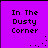 Purple background with black pixelated text reading "In The Dusty Corner" and scattered white dots in four quadrants.